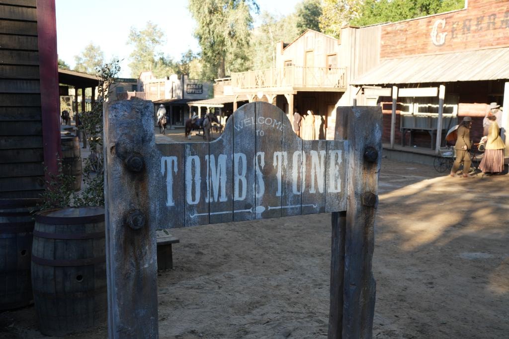 Western town set with a Tombstone entrance sign from Life, Larry and the Pursuit of Unhappiness